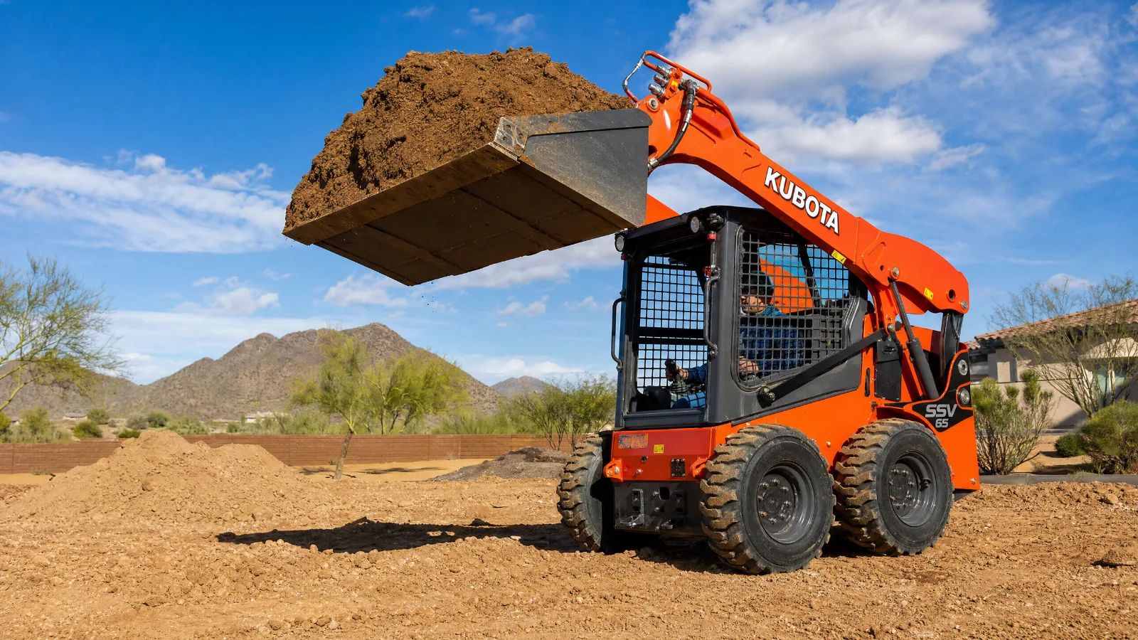 Kubota SSV65 heavy-duty skid steer rental from Desert Loader Rentals with enclosed cab